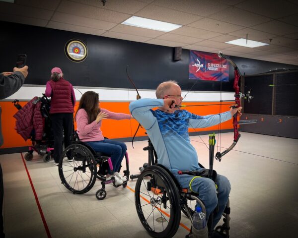 Adaptive archery — wheelchair users taking aim at the range